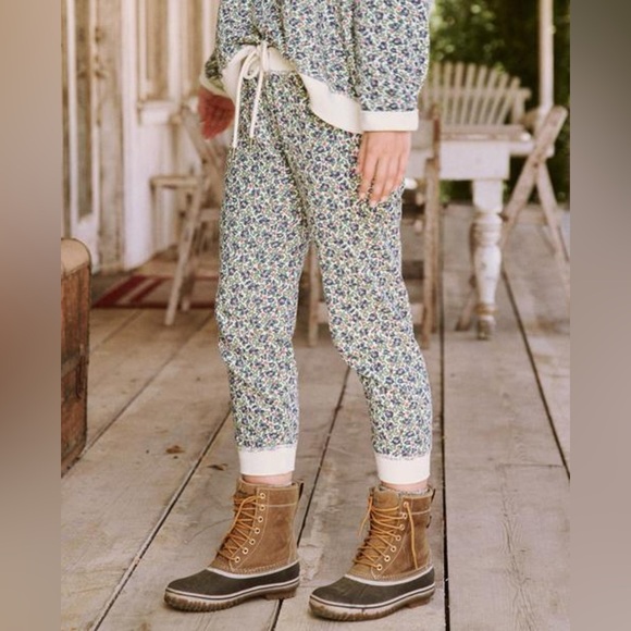 The Great. The Cropped Sweatpants Cream Field Floral Pants...